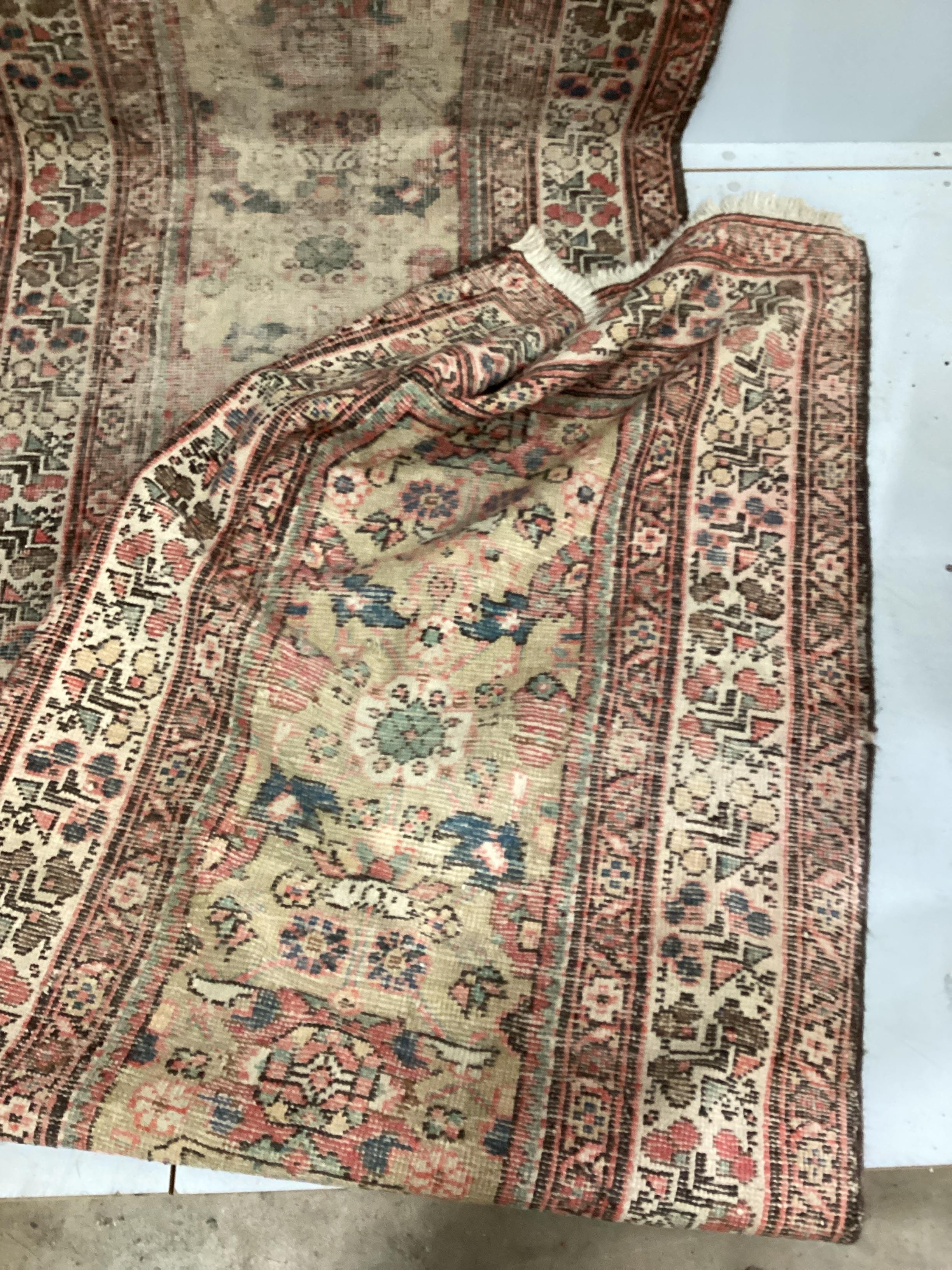 An antique North West Persian ivory ground runner (severely worn), 470 x 92cm